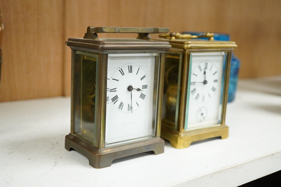 A brass carriage timepiece with alarm and one other, one with key, largest 15cm high